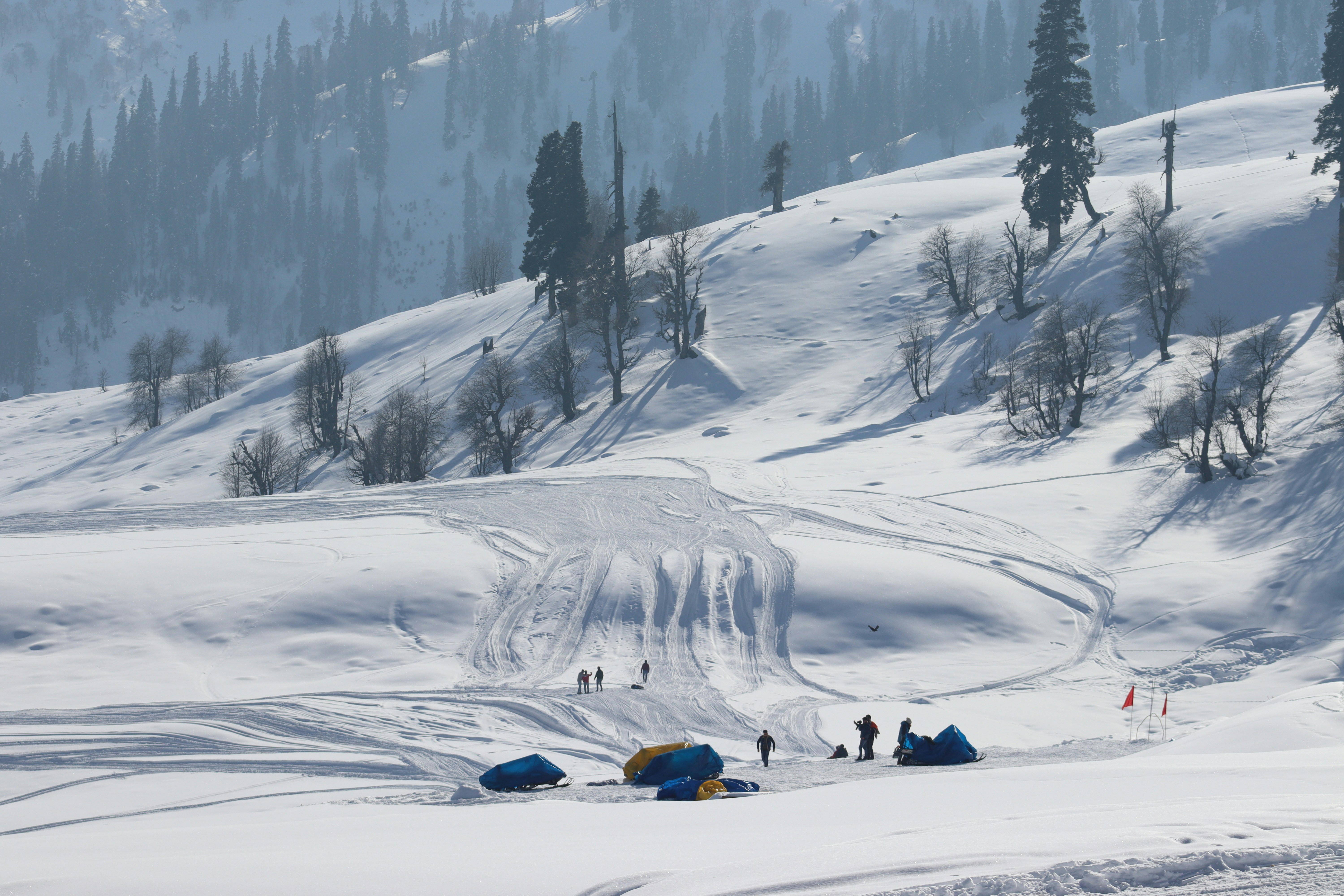 Asia winter travel collage: skiing, hot springs, beaches
