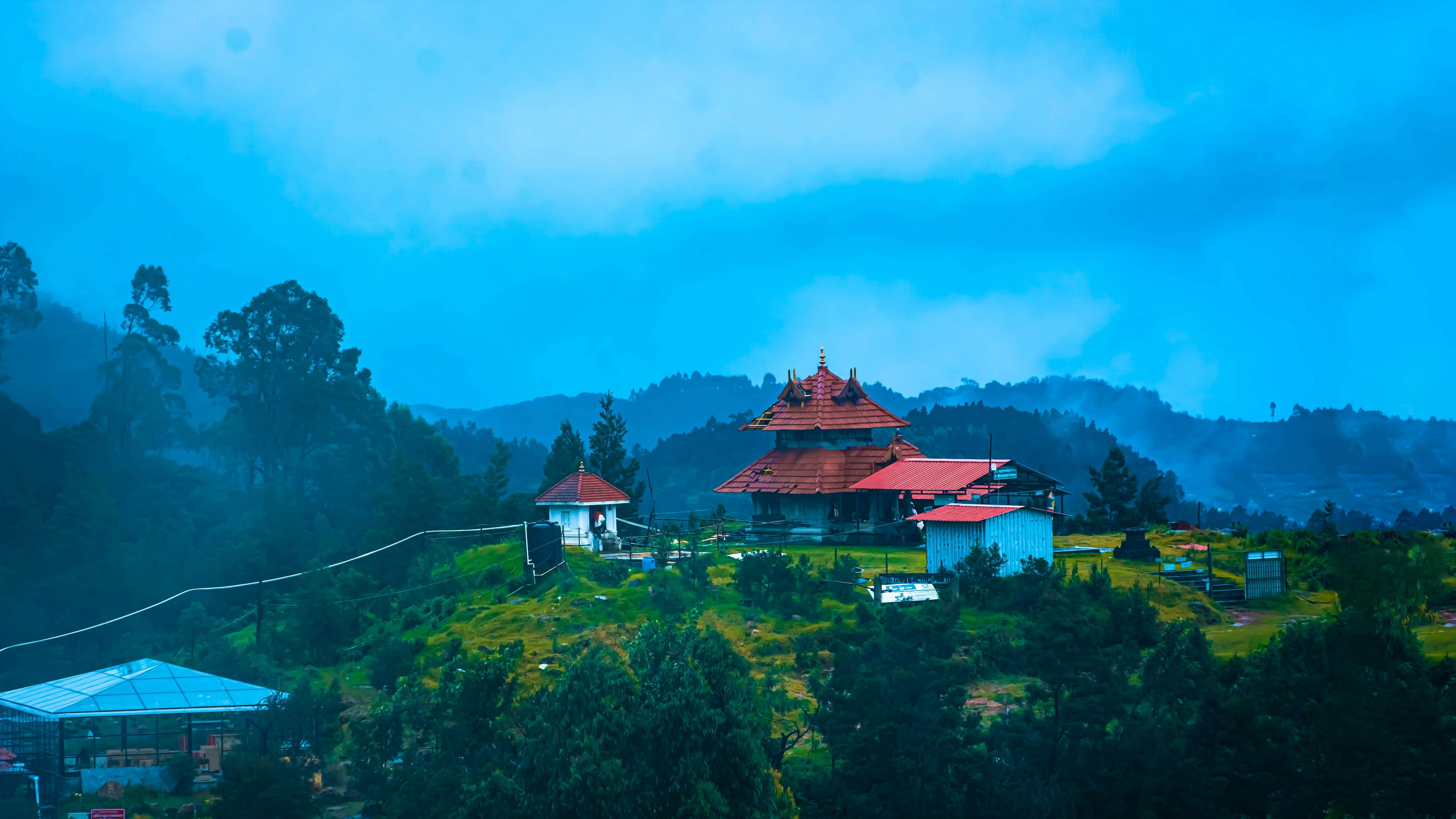 Panoramic view of a classic Indian hill station with pine forests and mountains